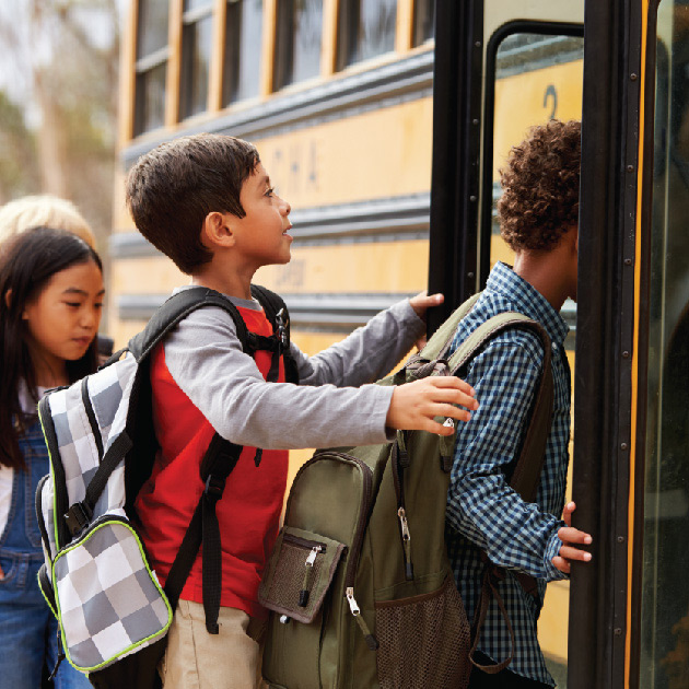 Kids getting on school bus